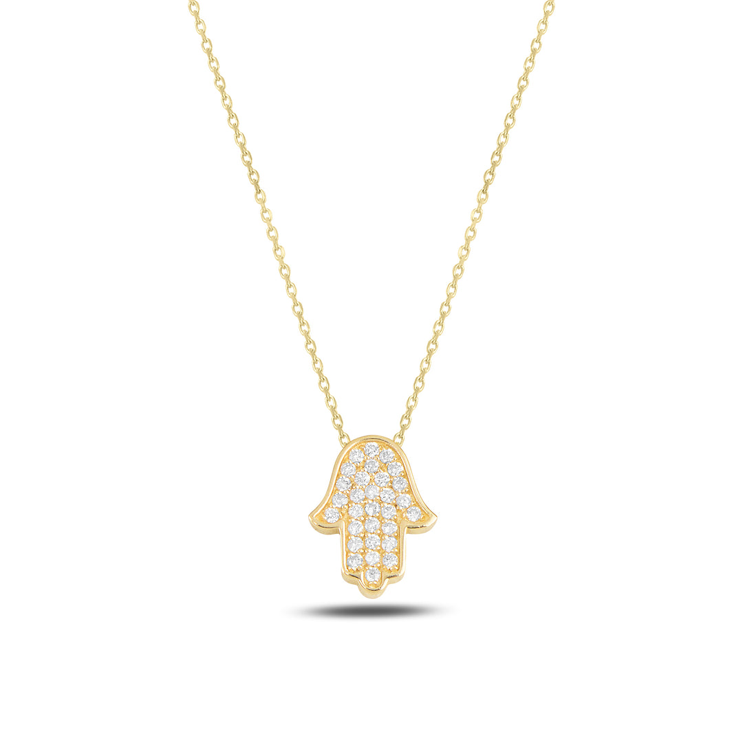Gold Hamsa hand necklace on a white background
