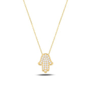 Gold Hamsa hand necklace on a white background